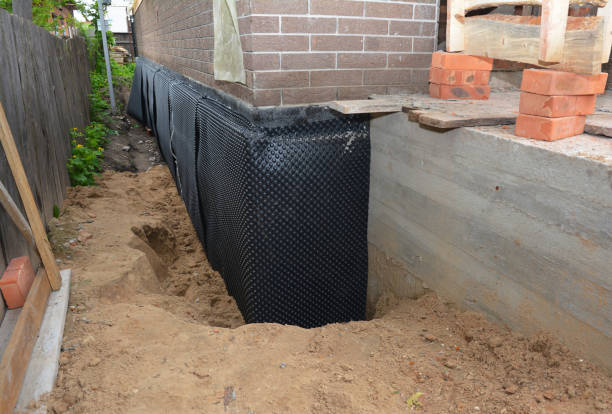 Happy homeowners after waterproofing job in Greenvale